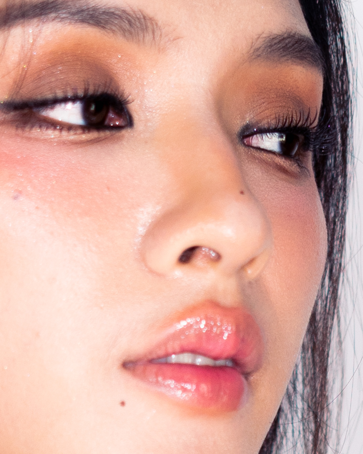 Thai Glam — extreme eye close-up, warm brown